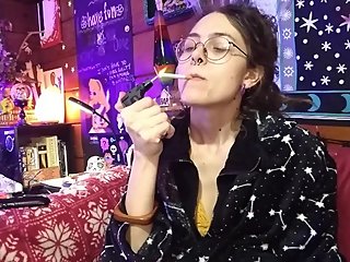 Sexy Hippie Goddess Girl With Dreadlocks Lights and Smokes Cigarette